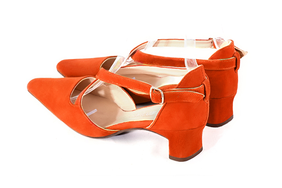 Women's clementine orange open side dress shoes, with crossed straps. Tapered toe. Low kitten heels - Rear view